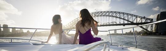 Yacht sailing, Sydney Harbour Two women on front of yacht sailing on Sydney Harbour