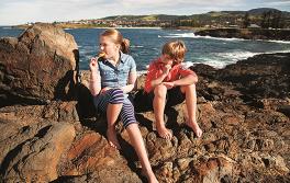 Kiama beach, South Coast Kids eating ice cream on Kiama beach, South Coast